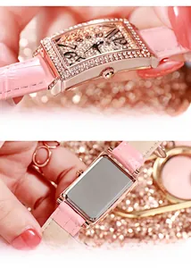 Macro detail of luxury pink leather strap watch and engraved stainless steel case back