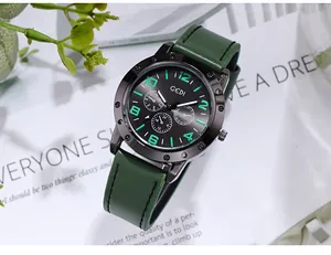 Detail of GEDI men's watch featuring a black case, green leather strap, and three sub-dials