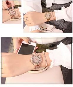 Detail view of rose gold women watch set with starry diamond dial and roman numerals