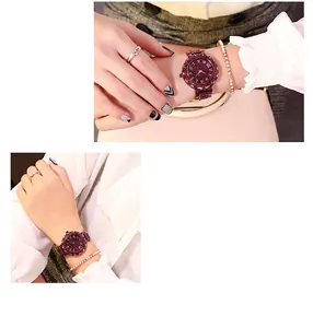 Close-up of luxury women watch with rhinestone dial and matching metal chain bracelet