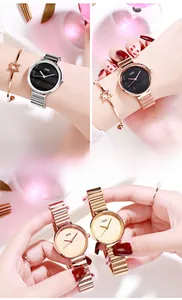 Close-up of minimalist quartz watch with bamboo-style band and starry bracelet sets