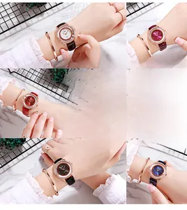 Détail d'une montre de luxe pour femme avec lunette en cristal et bracelet jonc assorti