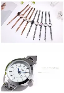 Detail of GEDI watch dial with blue needles, rhinestone markers and slim metal band