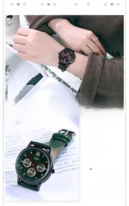 Detail of GEDI fashion watches with black and deep green leather straps and gold Roman numerals
