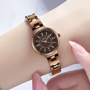 Elegant rose gold women watch with deep brown dial and rhinestone index markers