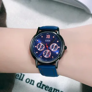 GEDI fashion watch with navy blue dial, rose gold sub-dials and leather strap on wrist