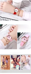 Detail of rose gold quartz watch with 3D floral dial and elegant leather strap