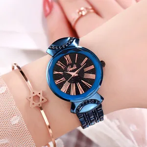 Rose gold ladies watch with starry dial, Roman numerals and navy steel strap