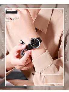 Close-up of GEDI vintage women watch with black Roman numeral dial and leather strap