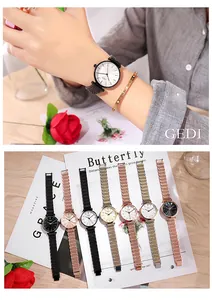 Detail view of stylish women's watches in various colors with mesh and link metal straps