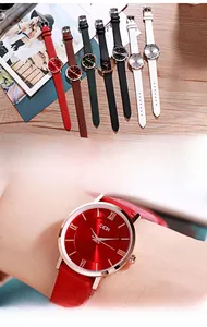 Detail view of colorful leather strap watches featuring minimalist Roman numeral dials