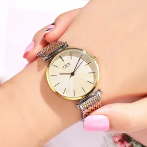GEDI minimalist quartz watch for women with two-tone mesh strap and champagne sunray dial