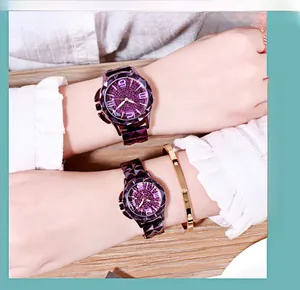Detail showing women's purple diamond dial watch with geometric faceted metal strap