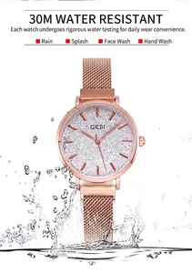 Detail of rose gold mesh watch showing 30m waterproof performance with water splashes