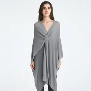 Women's grey knit shawl wrap with center twist knot design for a stylish v-neck silhouette