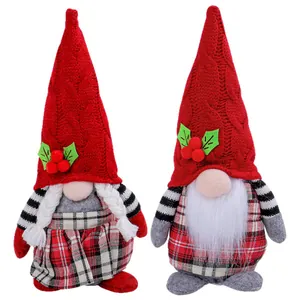 Pair of Christmas faceless gnomes with plaid hats and braids for home table decoration