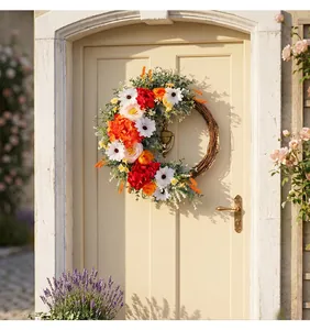 Detailed close-up of artificial rose wreath with daisies and green leaves on wooden door