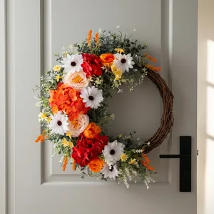 Floral wreath with roses, daisies and hydrangea on a natural rattan ring for door decor