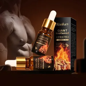 Macro shot of men's private care essential oil with gold dropper and amber glass bottle