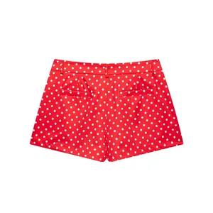 Rear view of red polka dot shorts with welt pockets and belt loops for women