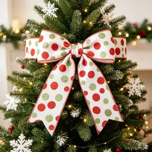 Christmas tree topper bow with red and green glitter polka dots on white fabric ribbon