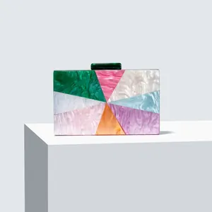 Detailed macro view of colorful marble acrylic clutch bag with geometric inlay pattern