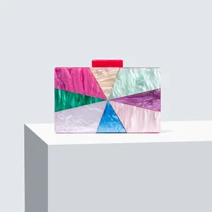 Detail view of colorful marbled acrylic evening clutch bag with radial pattern design