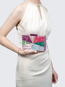 Detail of multicolored acrylic evening clutch with marble texture and geometric patterns