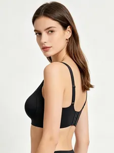 Adjustable wide straps and multi-row back closure on seamless black lifting bra