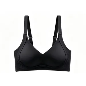 Macro detail of seamless black wireless bra showing side wing texture and wide strap