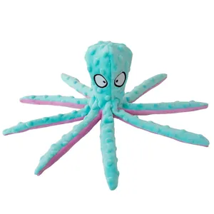 Detail of blue octopus plush dog toy with textured dot fabric and squeaky tentacles