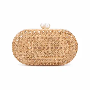 Detailed close-up of handmade woven rattan clutch with elegant double pearl clasp