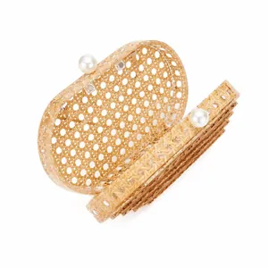 Elegant oval rattan evening clutch with hexagonal weave and large pearl clasp detail