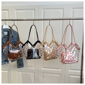 Transparent PVC tote bags with cherry patterns and inner drawstring pouches in four colors