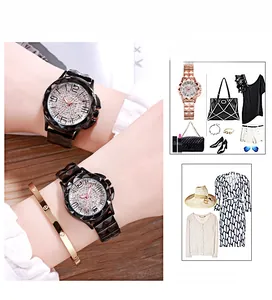 Close-up of diamond-studded ladies watch with steel band and gold screw-motif bracelet