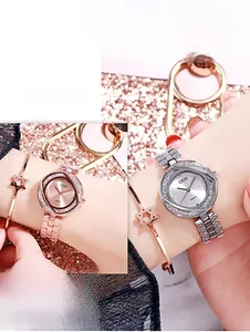 Détails de montre à quartz pour femme en or rose et argent avec lunette en strass