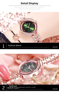 Détail de la montre en or rose avec cadran vert et verre minéral au poignet du modèle