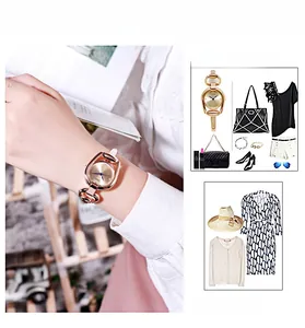 Detail of rose gold horseshoe quartz watch worn by a model in a fashion outfit styling