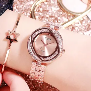 Montre femme en or rose avec bracelet en maille, lunette en strass et jonc étoile assorti