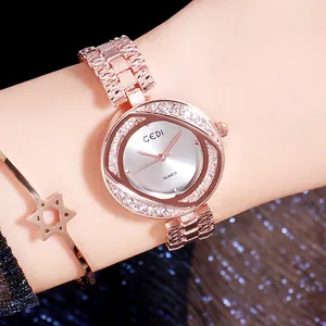 Montre à quartz élégante or rose pour femme avec lunette sertie de cristaux brillants