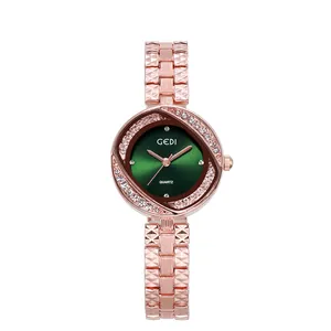 Montre élégante pour femme en or rose avec cadran vert et lunette en strass