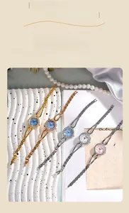 Elegant women's quartz watches with rhinestone bezels and metal hollow bracelets in five colors