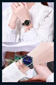Detail of GEDI quartz watch with sunray dial and leather strap paired with heart jewelry