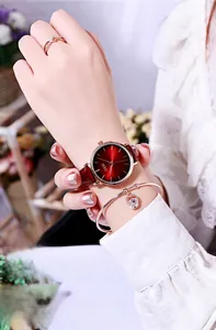 Detail of GEDI lady watch with red dial and rose gold crown bracelet on female wrist