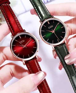 Detail view of stylish women's watches in burgundy and dark green with glitter leather straps