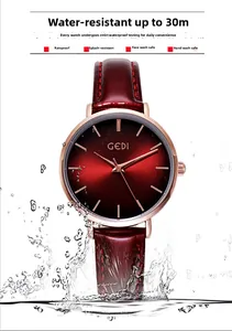 Close-up of rose gold watch with red dial and 30m water resistance splashing in water