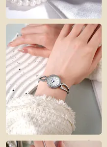 Detail of GEDI diamond-encrusted silver bracelet watch on a pearl background