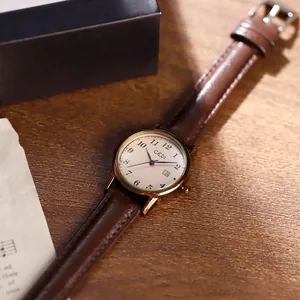 Vintage women's quartz watch with brown leather strap and rose gold round case