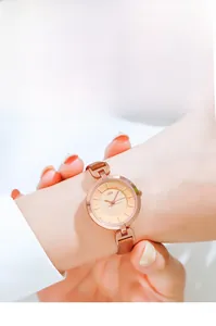 Close-up of GEDI women watch with rose gold dial and slim brown leather strap