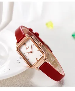 Detail view of Gedi quartz watch with a red leather strap and rose gold rectangular case